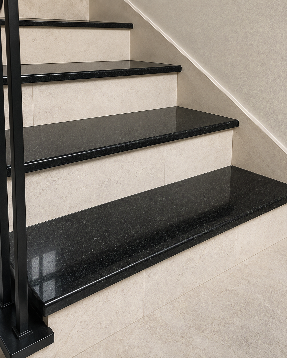 Dark stone stair treads in an interior staircase